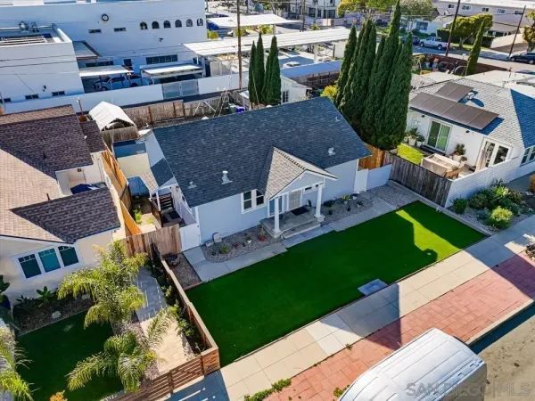 an aerial view of a house with a garden and plants