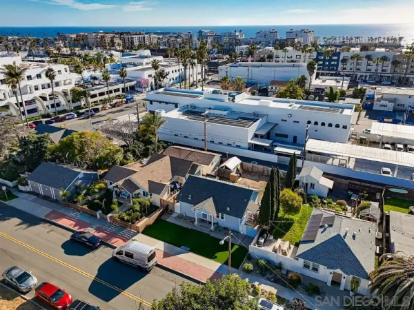 an aerial view of a house with a ocean view