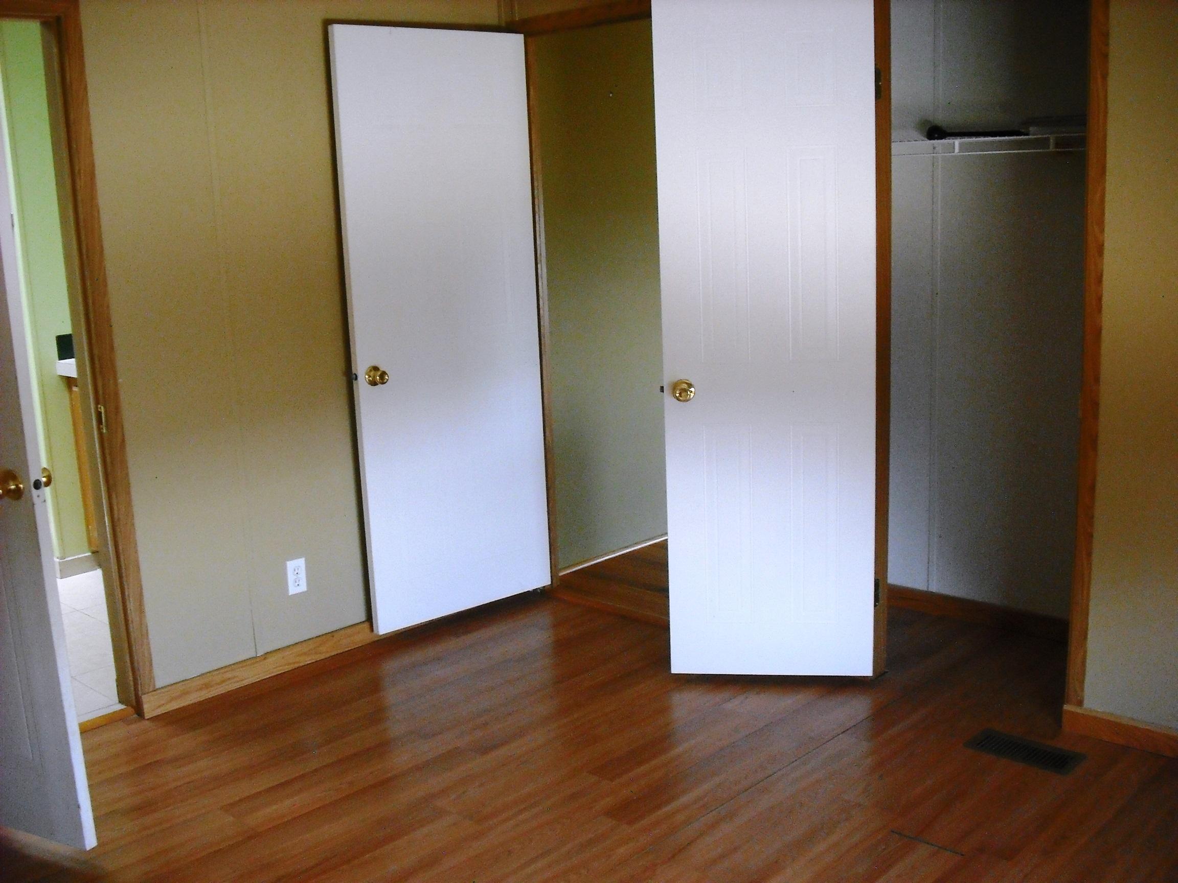 504 Ragsdale Road Norwood, CO 81423 - Photo 13 of 17 an empty room with wooden floor and closet