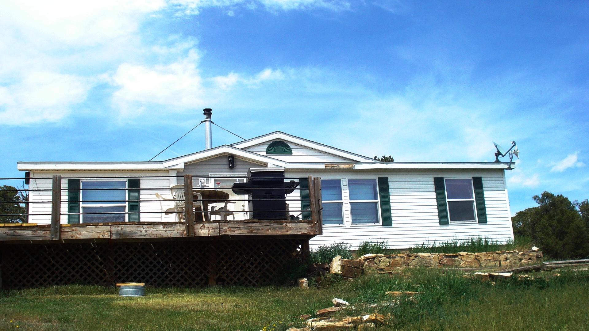 504 Ragsdale Road Norwood, CO 81423 - Photo 16 of 17 a front view of a house with a garden