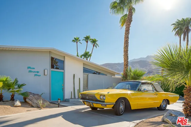 a car parked in front of a house