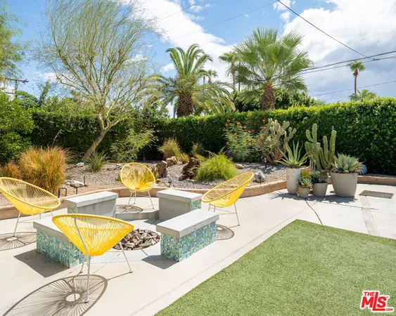 a view of a swimming pool with lounge chairs