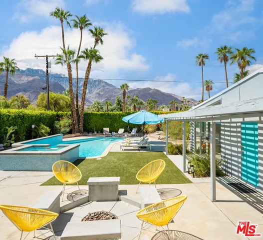 a view of a swimming pool with a lounge chairs