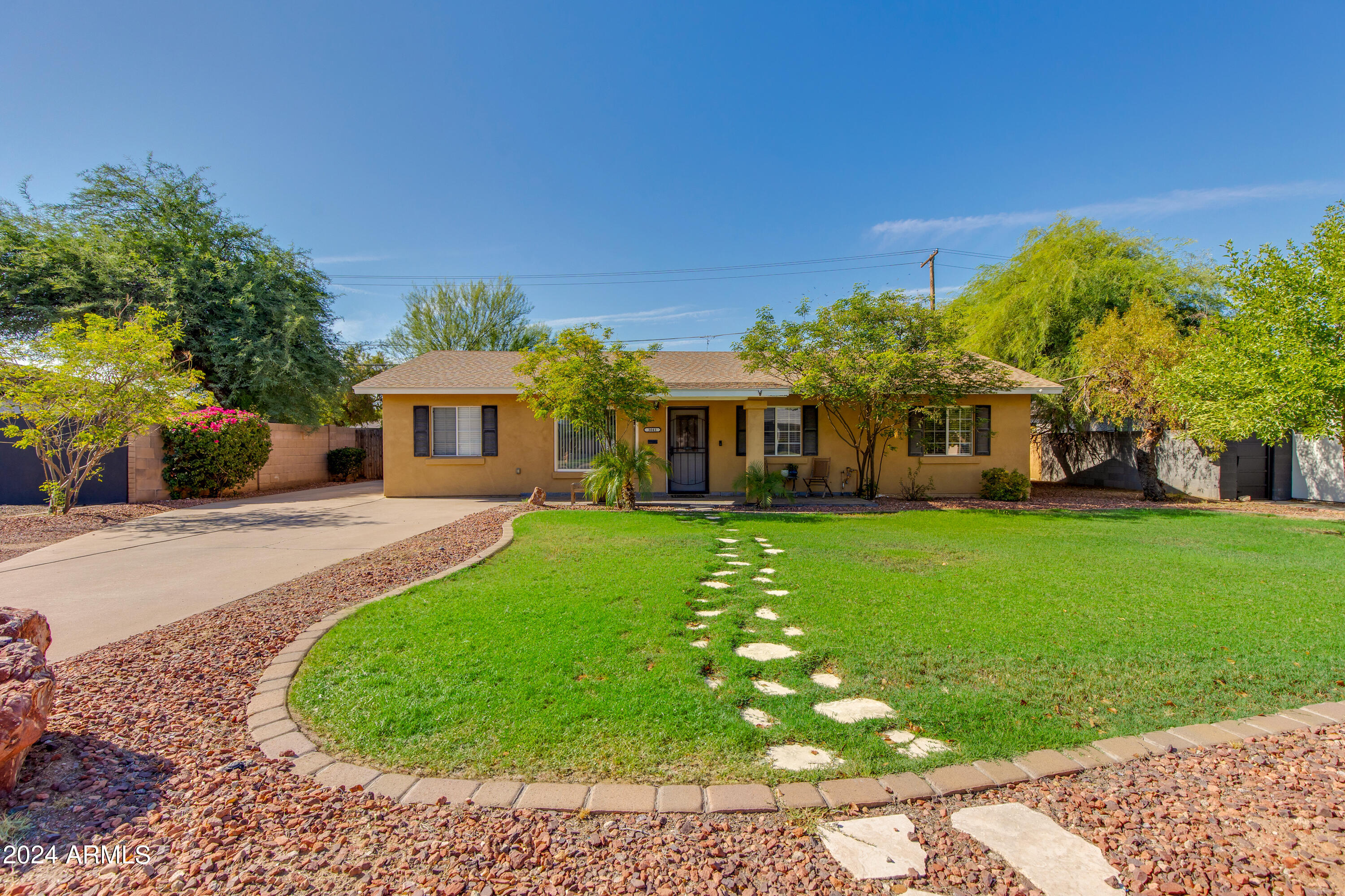 3041 East Roma Avenue Phoenix, AZ 85018 - Photo 1 of 14 a front view of a house with a yard