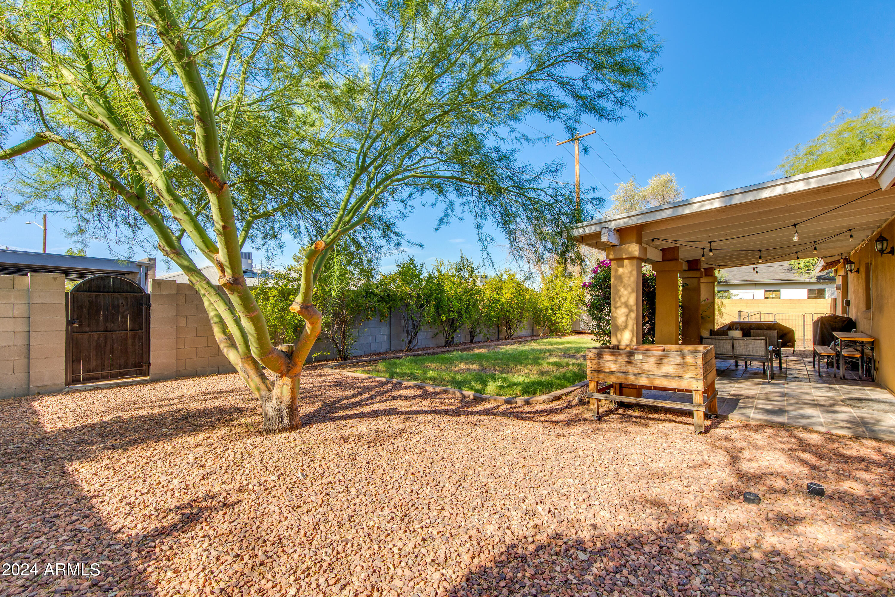 3041 East Roma Avenue Phoenix, AZ 85018 - Photo 14 of 14 a view of a house with backyard and sitting area