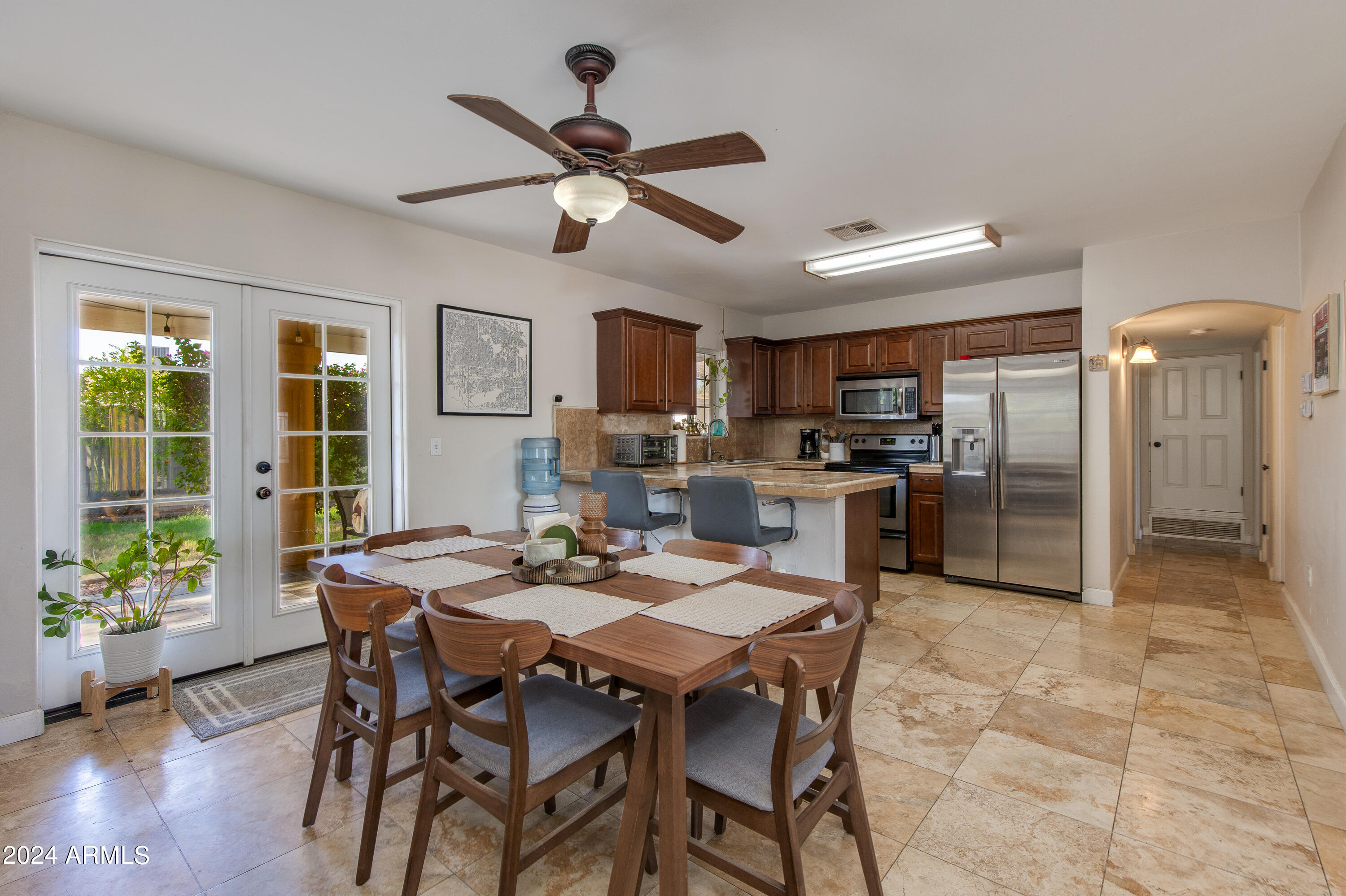 3041 East Roma Avenue Phoenix, AZ 85018 - Photo 4 of 14 a view of a dining room with furniture window and wooden floor