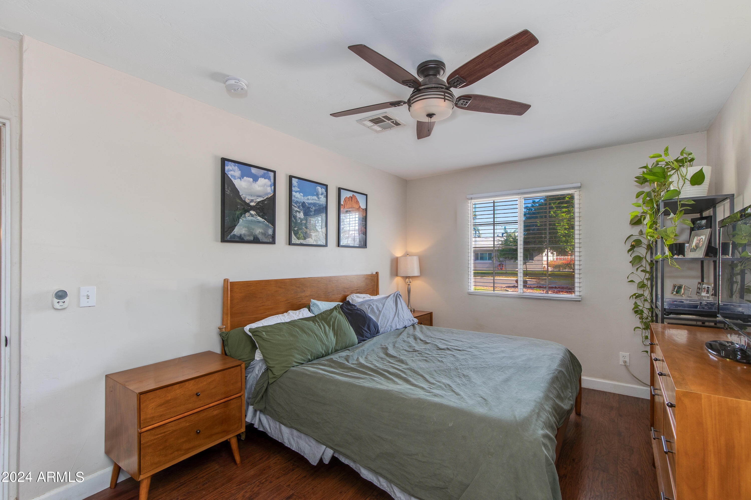 3041 East Roma Avenue Phoenix, AZ 85018 - Photo 7 of 14 a bedroom with a bed and a chandelier