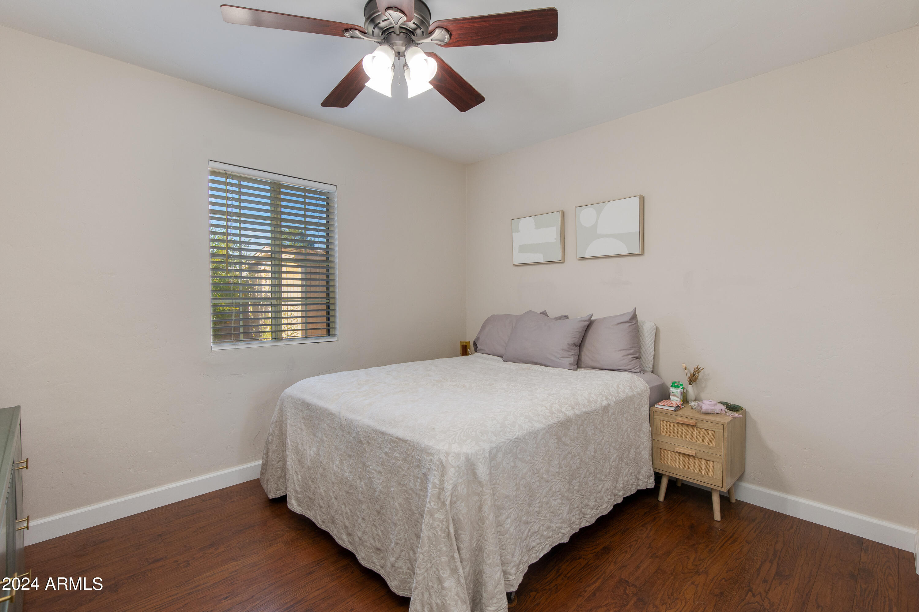 3041 East Roma Avenue Phoenix, AZ 85018 - Photo 9 of 14 a bed room with a bed and a window
