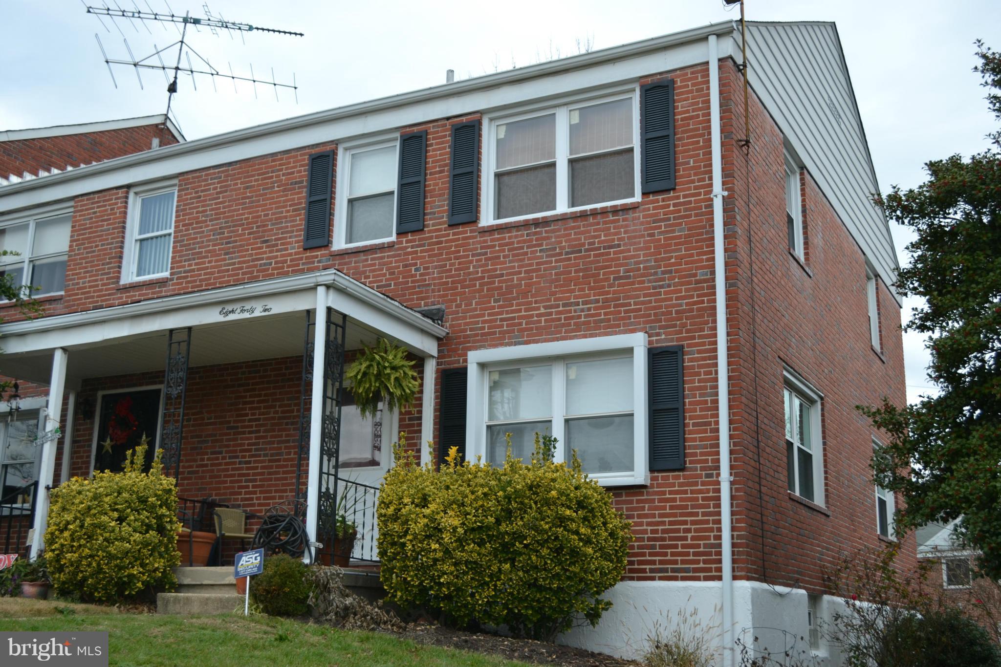 842 Bradhurst Road Baltimore, MD 21212 - Photo 1 of 28 a front view of a house with a yard