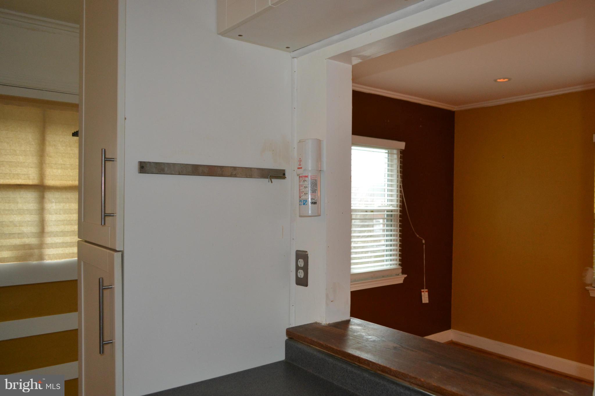 842 Bradhurst Road Baltimore, MD 21212 - Photo 15 of 28 a living room with a window and wooden floor