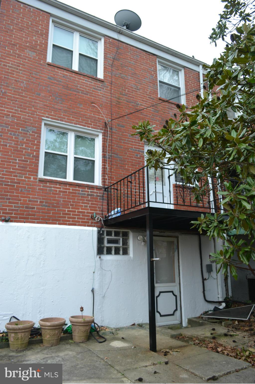 842 Bradhurst Road Baltimore, MD 21212 - Photo 26 of 28 a front view of a house with balcony