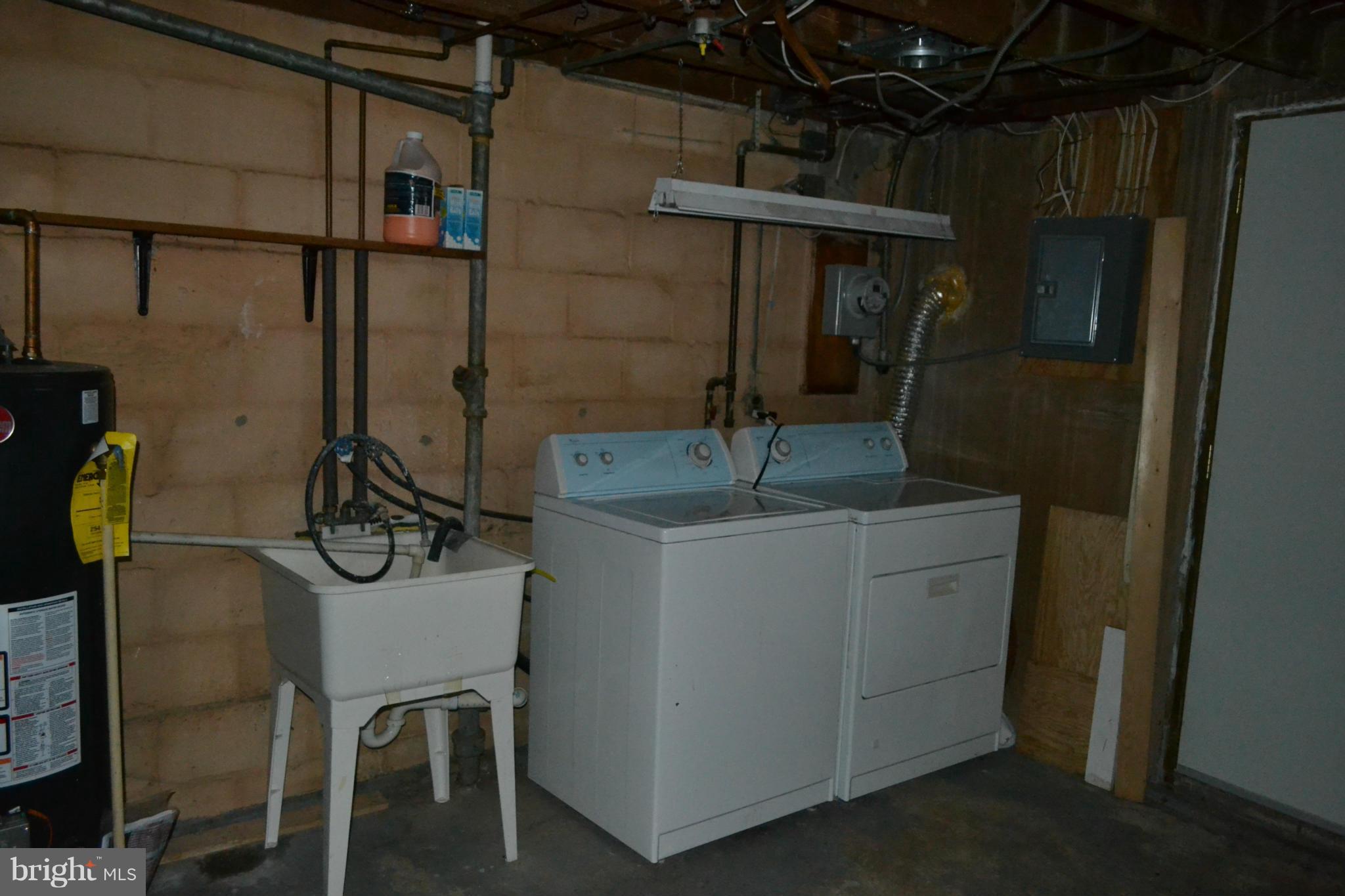 842 Bradhurst Road Baltimore, MD 21212 - Photo 27 of 28 a bathroom with a granite countertop sink a mirror and shower