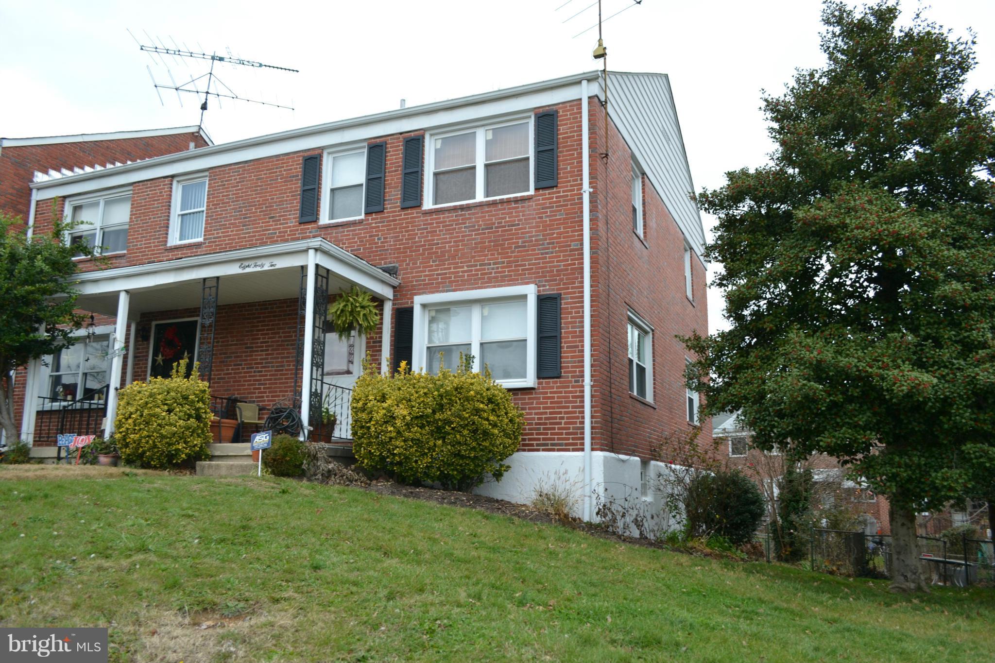 842 Bradhurst Road Baltimore, MD 21212 - Photo 5 of 28 a front view of a house with garden