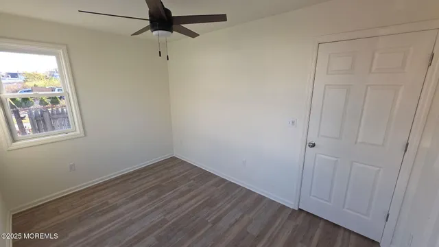 an empty room with wooden floor