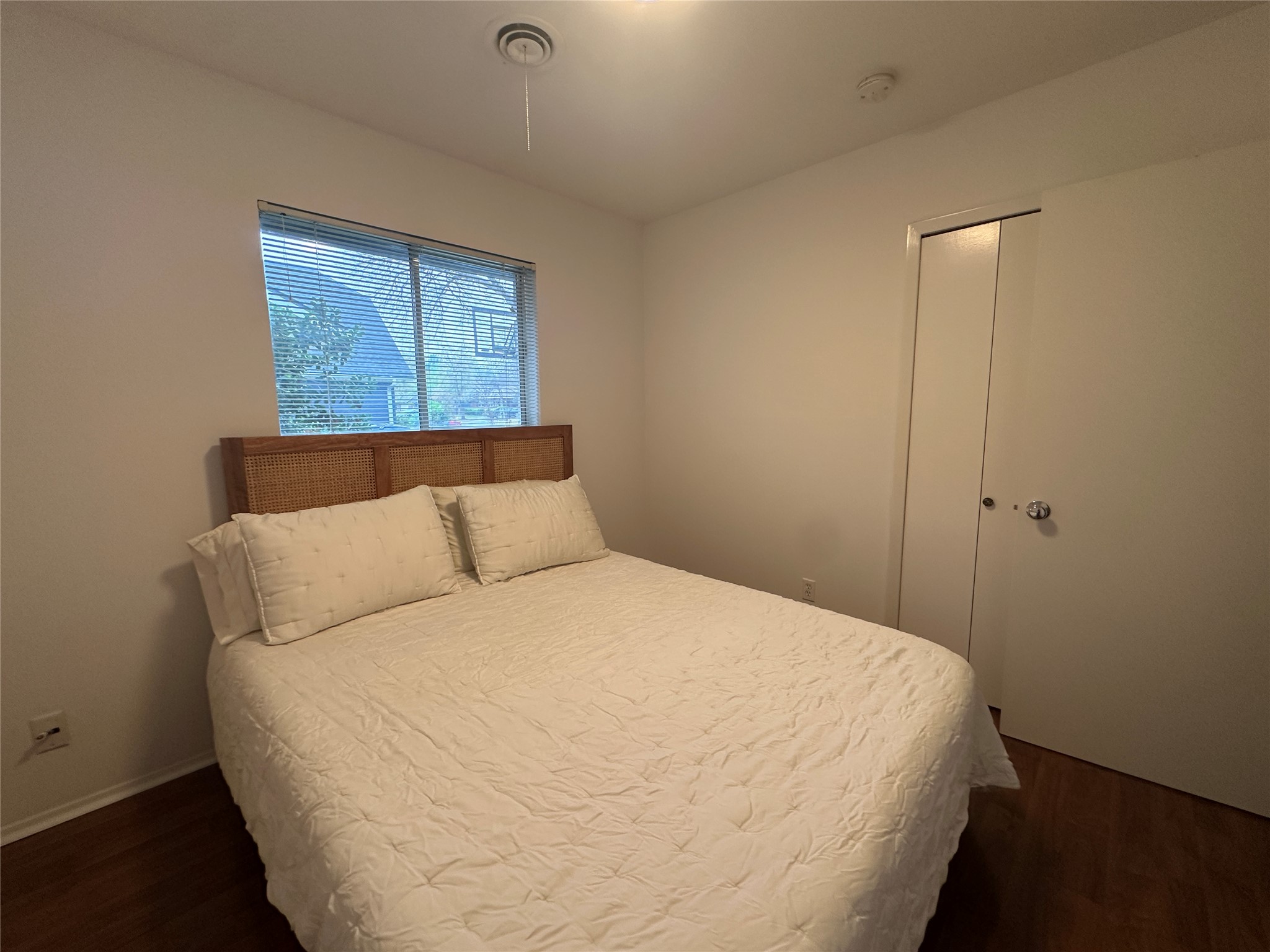 1908 Pompton Drive Austin, TX 78757 - Photo 12 of 22 a bed sitting in a bedroom next to a window