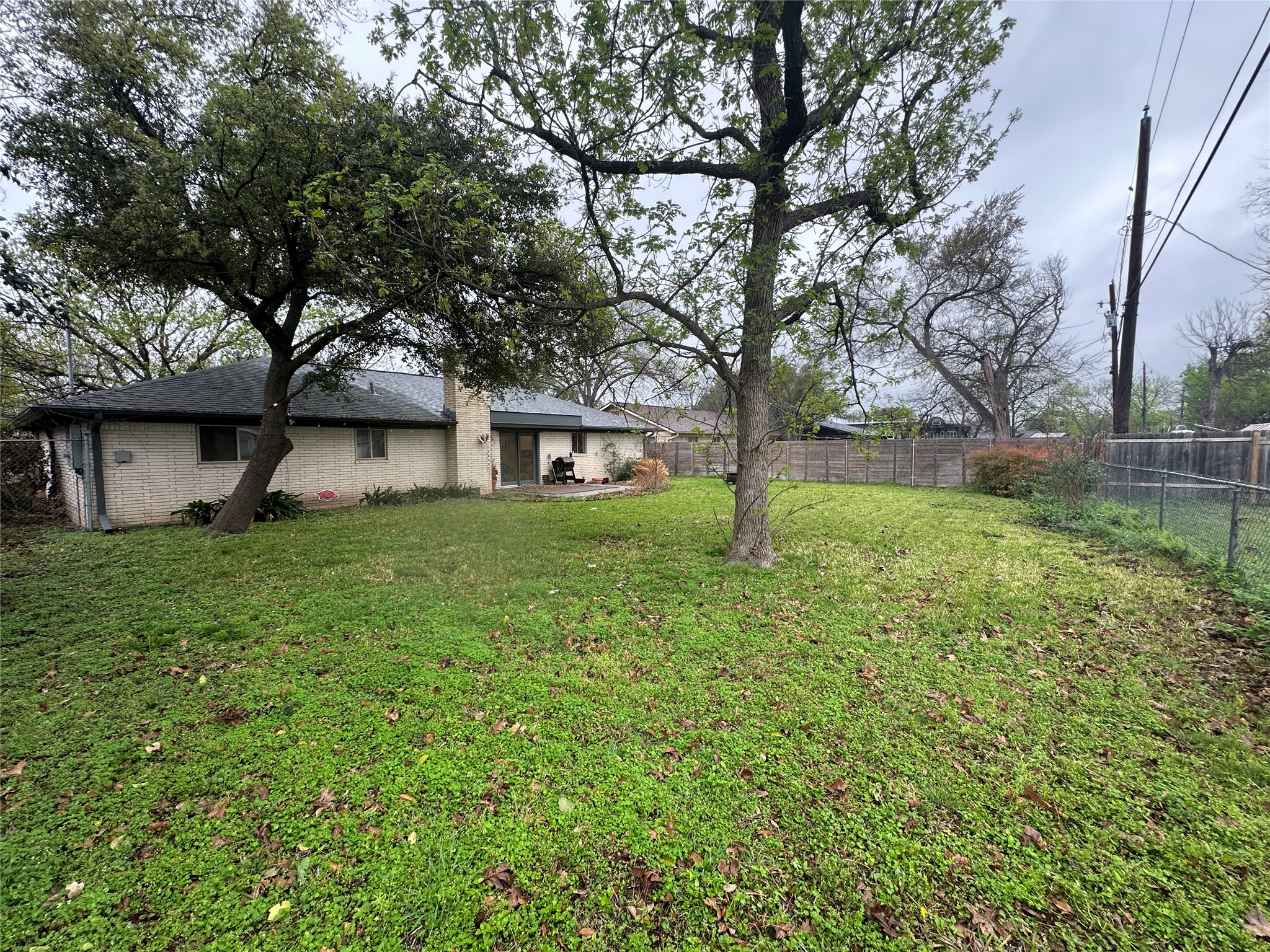 1908 Pompton Drive Austin, TX 78757 - Photo 18 of 22 a view of a house with a yard
