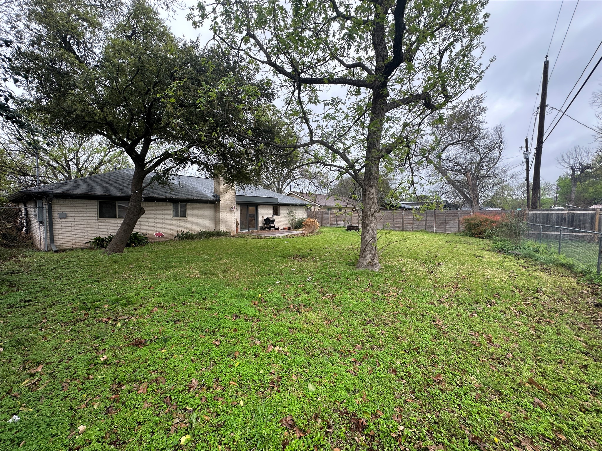 1908 Pompton Drive Austin, TX 78757 - Photo 19 of 22 a view of a house with a yard