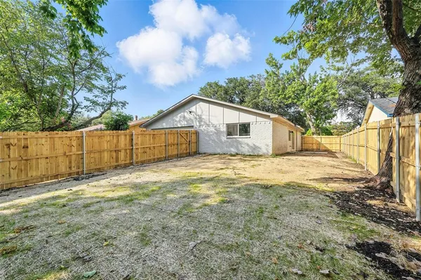 a view of a backyard of the house
