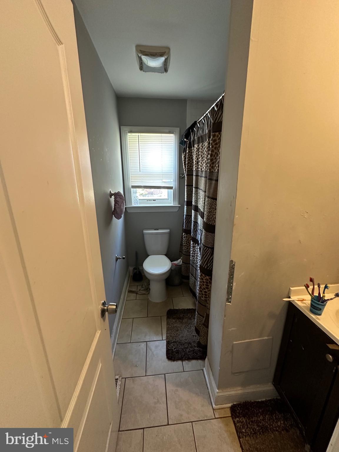 308 Sollers Point Road Dundalk, MD 21222 - Photo 11 of 22 a bathroom with a sink and a shower