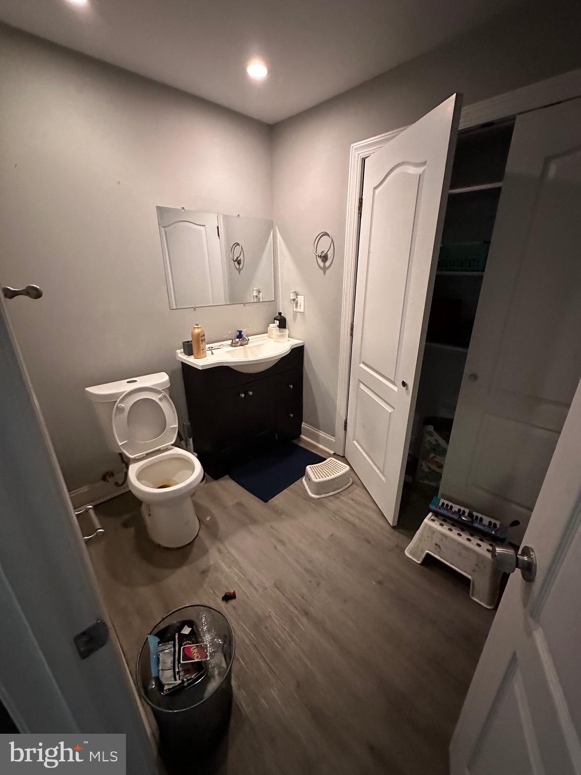 308 Sollers Point Road Dundalk, MD 21222 - Photo 16 of 22 a bathroom with a sink toilet and a mirror