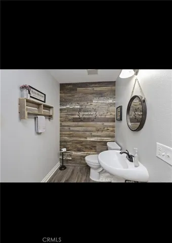 a view of bathroom with a sink and a mirror