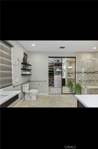 a bathroom with a sink and a large mirror