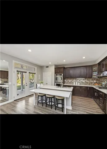 a view of a kitchen counter top space with stainless steel appliances