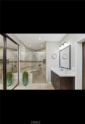 a bathroom with a sink and mirror