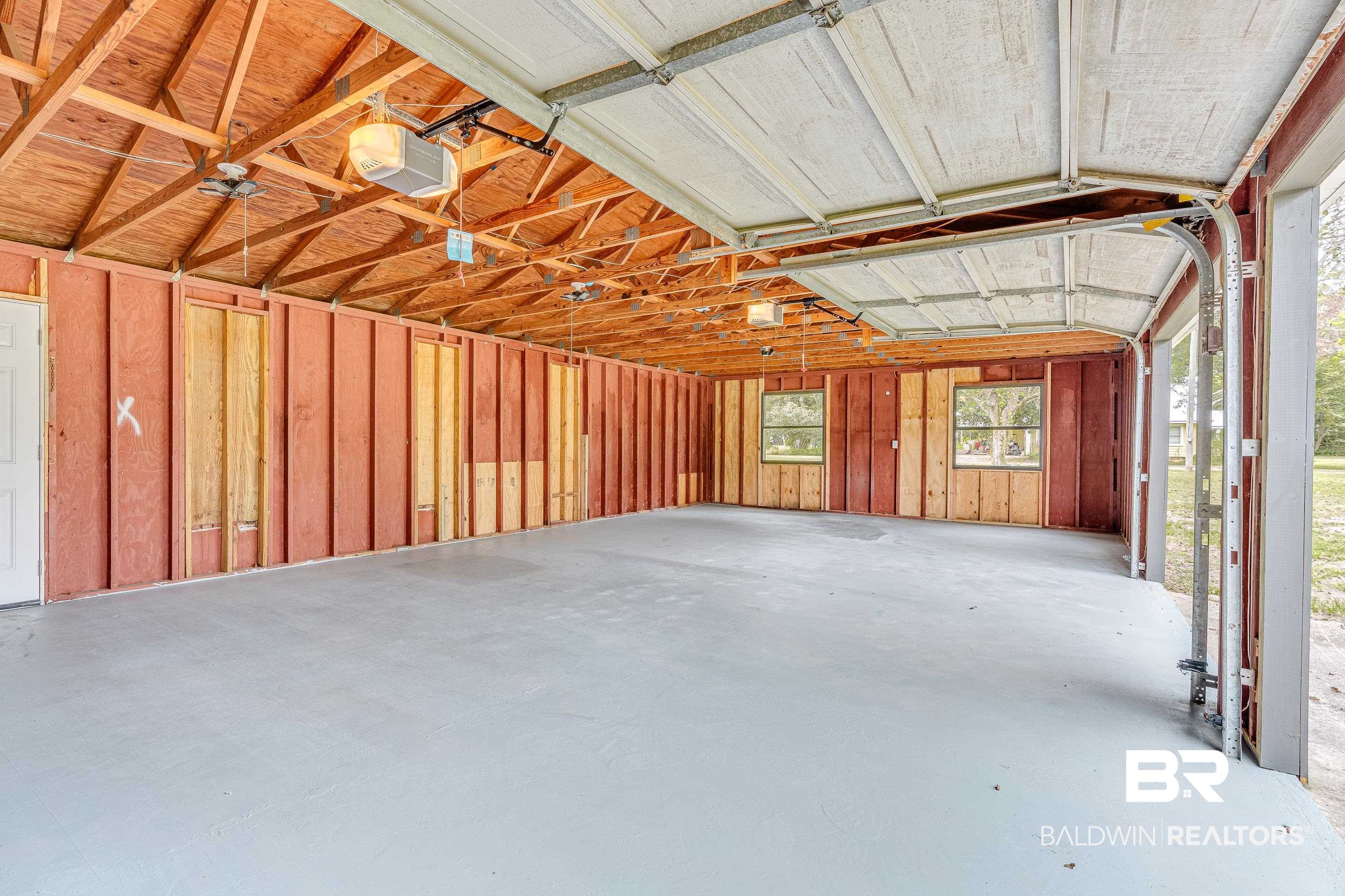 8001 16th Street Irvington, AL 36544 - Photo 27 of 35 Garage with a garage door opener