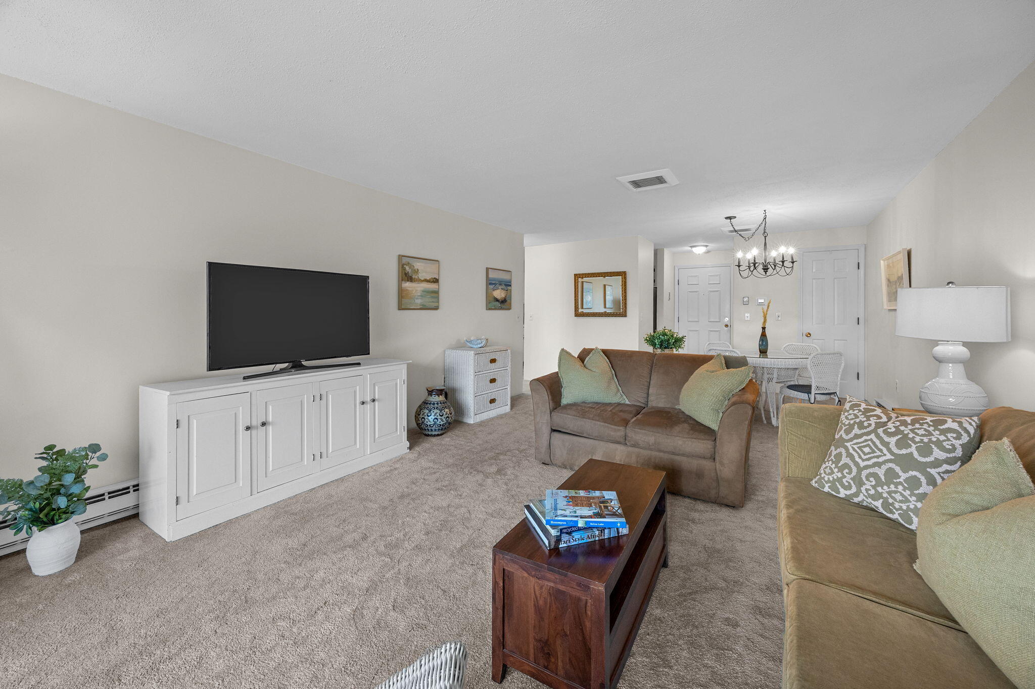 42 Old Colony Way, Unit 28 Orleans, MA 02653 - Photo 1 of 31 a living room with furniture and a flat screen tv