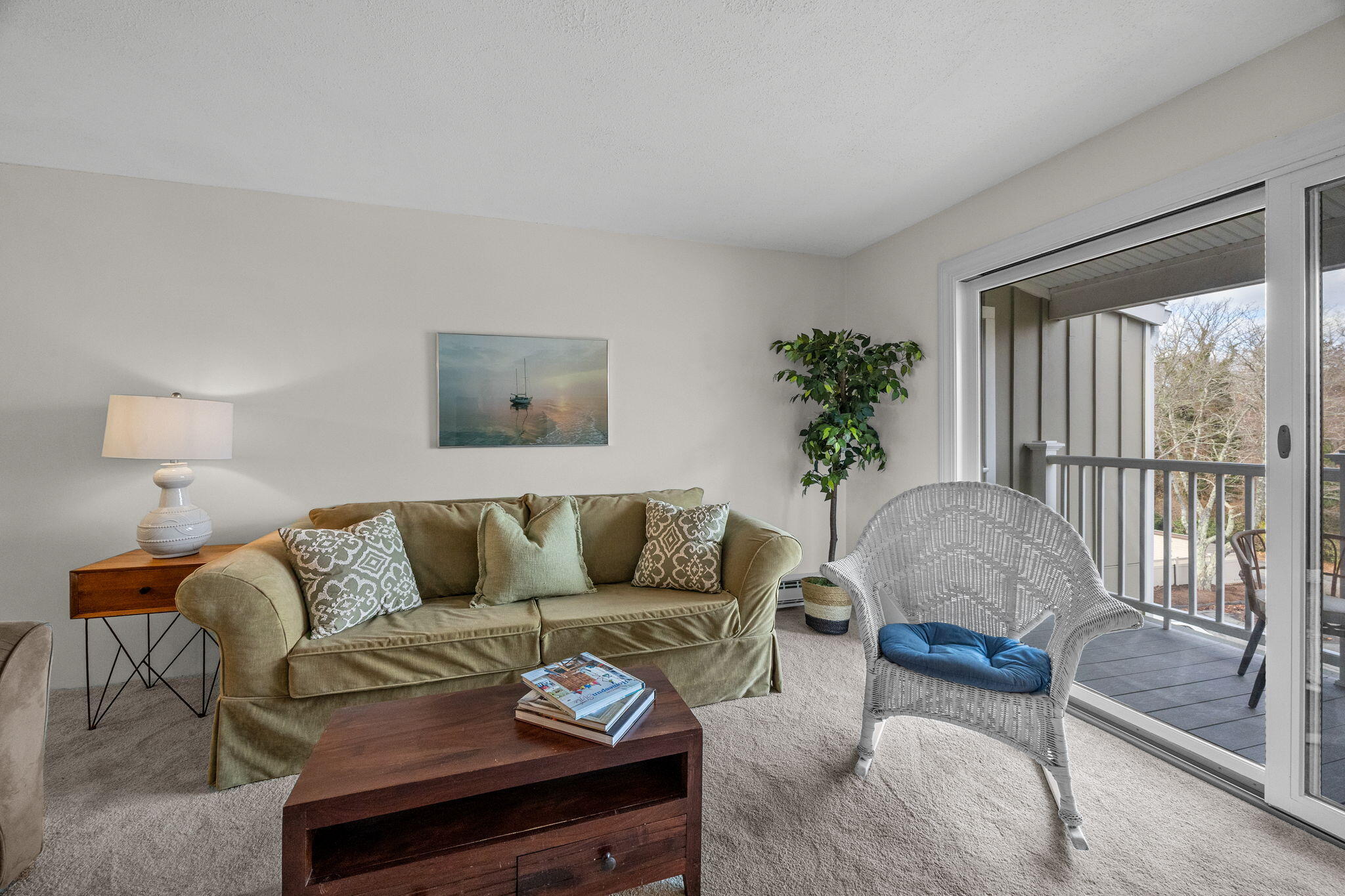 42 Old Colony Way, Unit 28 Orleans, MA 02653 - Photo 11 of 31 a living room with furniture and a potted plant