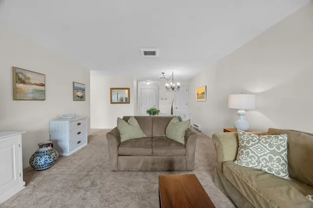a living room with furniture and a table