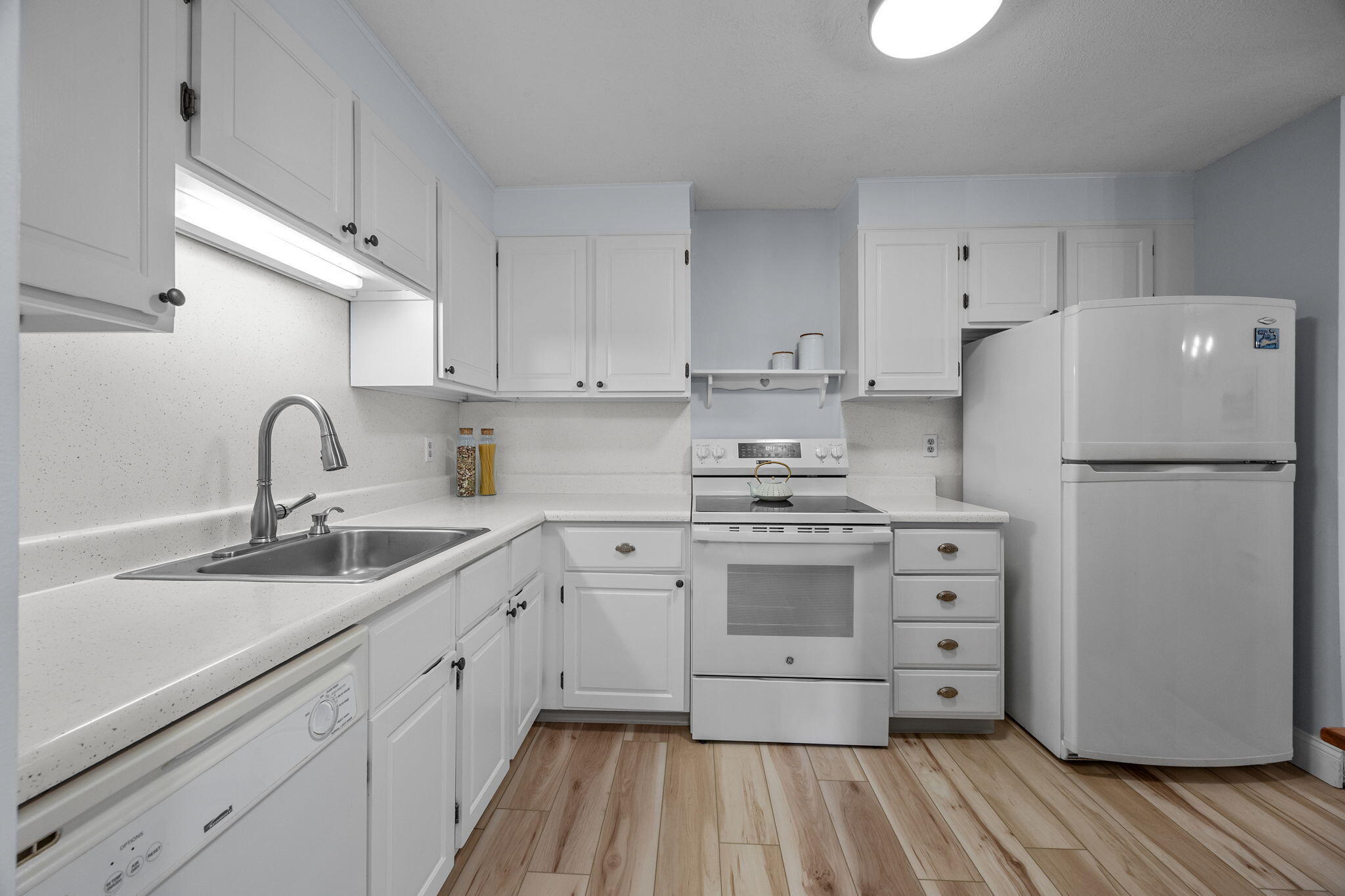 42 Old Colony Way, Unit 28 Orleans, MA 02653 - Photo 17 of 31 a kitchen with stainless steel appliances a refrigerator sink and cabinets