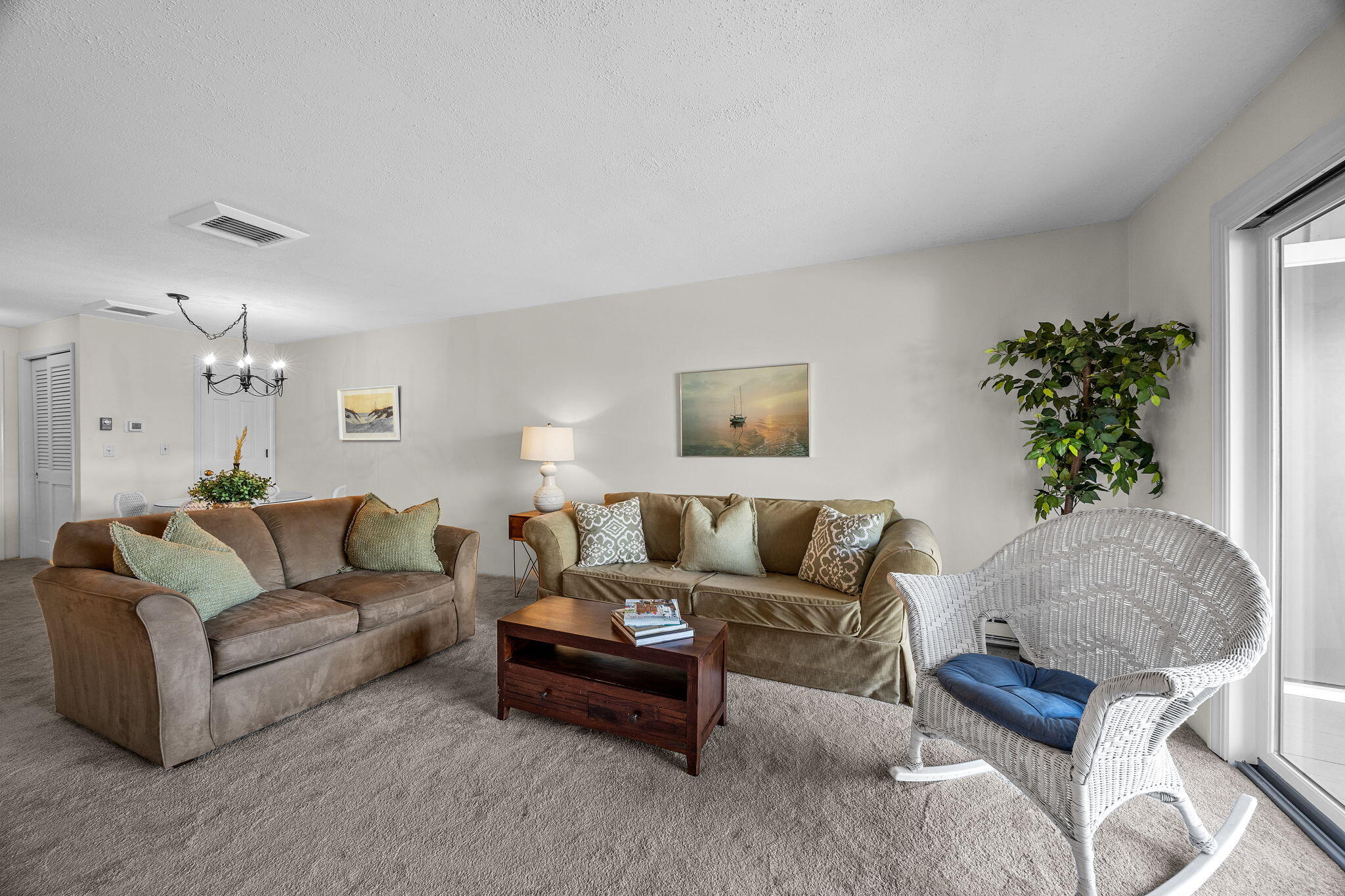 42 Old Colony Way, Unit 28 Orleans, MA 02653 - Photo 10 of 31 a living room with furniture and a potted plant