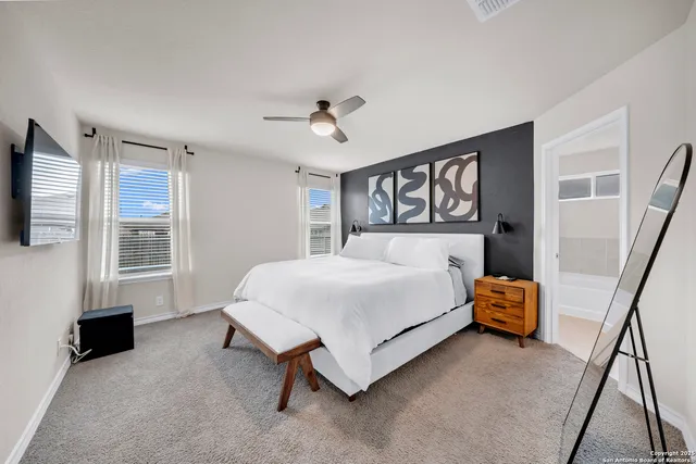 a bedroom with a bed and dresser