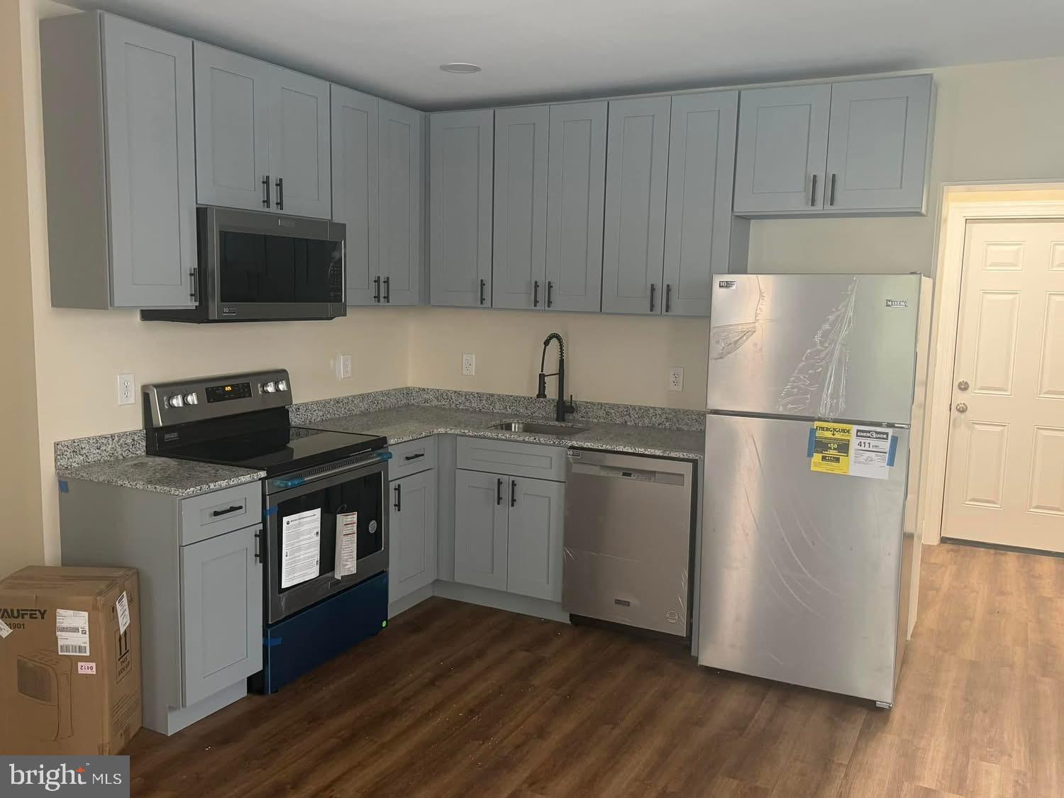 15 Sacco Road Royersford, PA 19468 - Photo 5 of 13 a kitchen with a refrigerator sink and microwave
