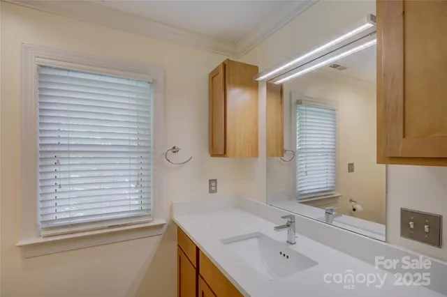a bathroom with a shower and a glass door