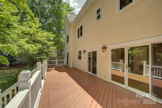 an aerial view of a house with a yard and lake view