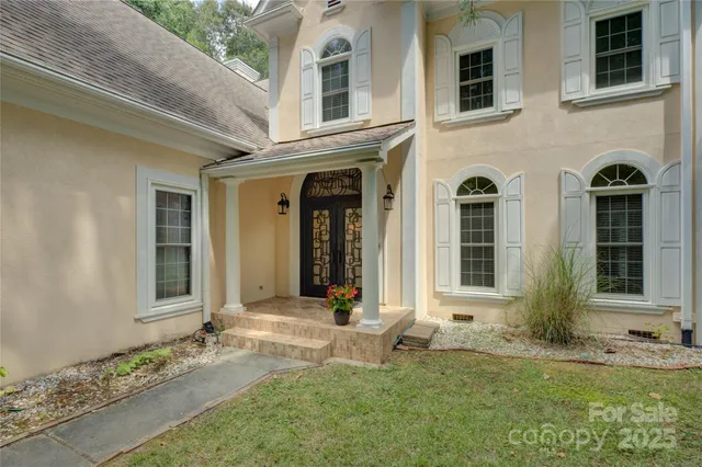 a view of a entryway door front of a house