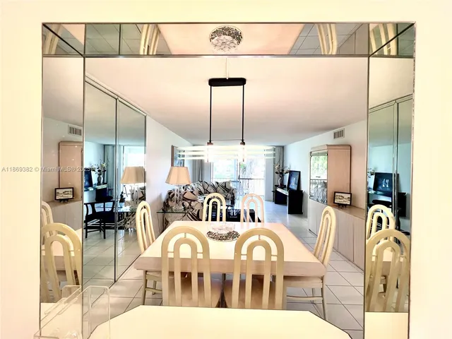 a view of a porch with a floor to ceiling window