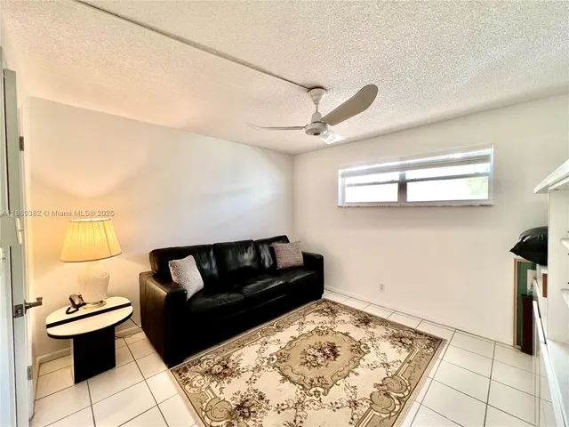 a living room with a couch and a rug