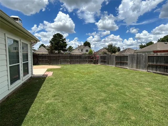 a view of a house with a swimming pool with a yard