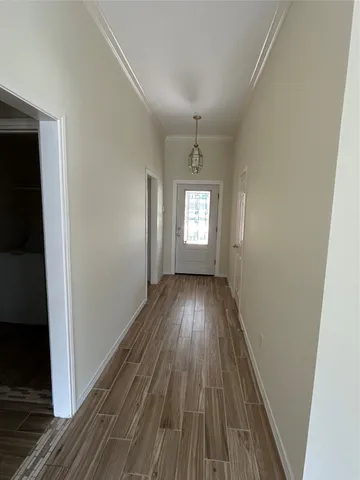 a view of wooden floor and windows in a room