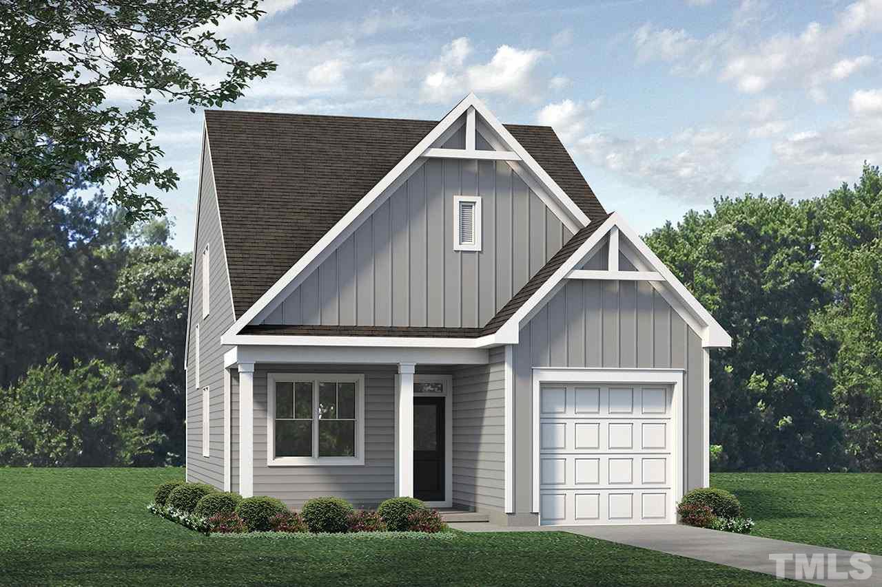 3705 Stark Road Raleigh, NC 27610 - Photo 1 of 2 a front view of a house with a yard