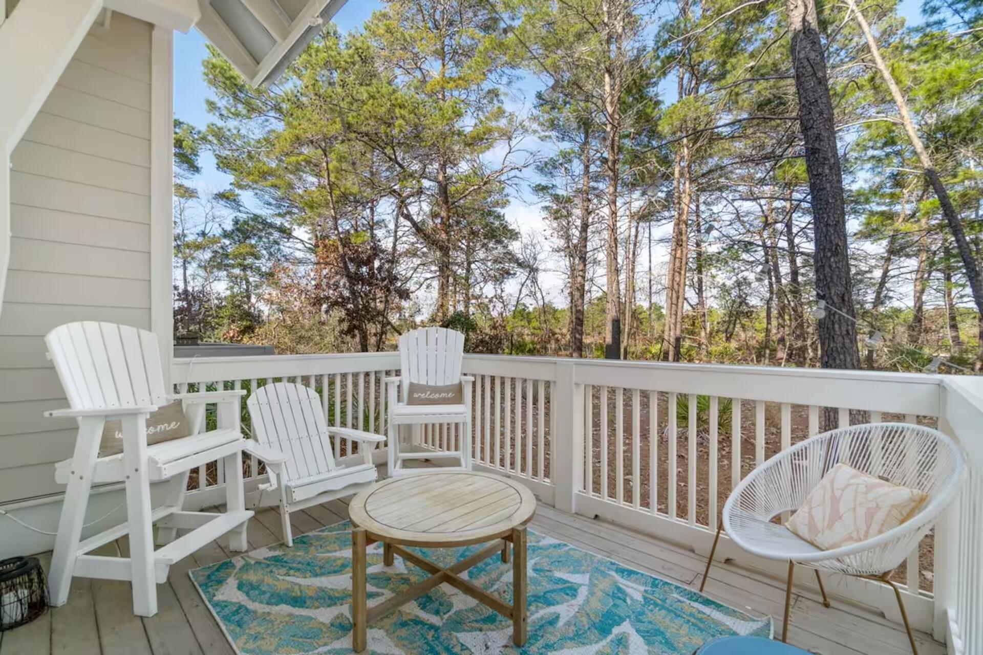 146 East E Pine, Unit B Inlet Beach, FL 32461 - Photo 45 of 47 a view of a chair and table on the deck