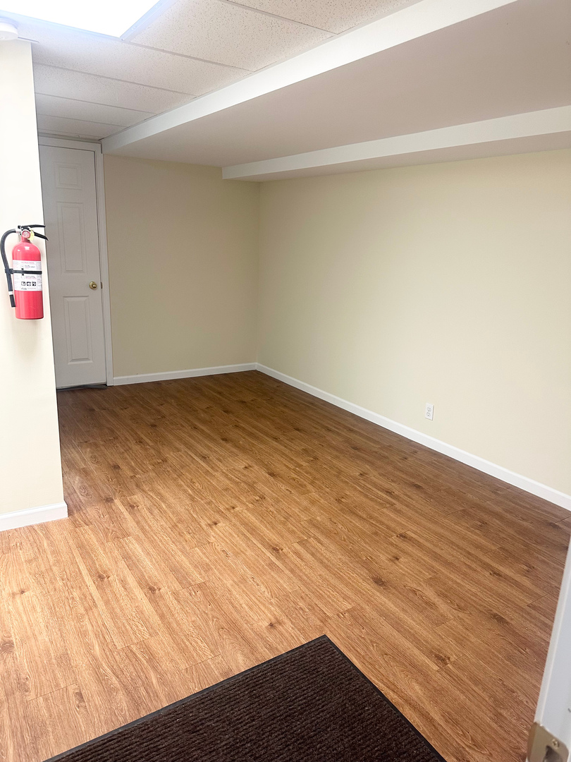 1151 Mary Court DeKalb, IL 60115 - Photo 12 of 20 a view of empty room with wooden floor