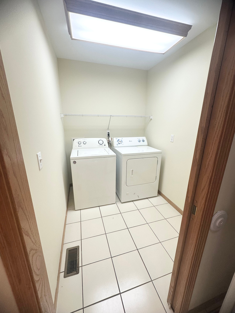 1151 Mary Court DeKalb, IL 60115 - Photo 7 of 20 a room with a washing machine and a sink