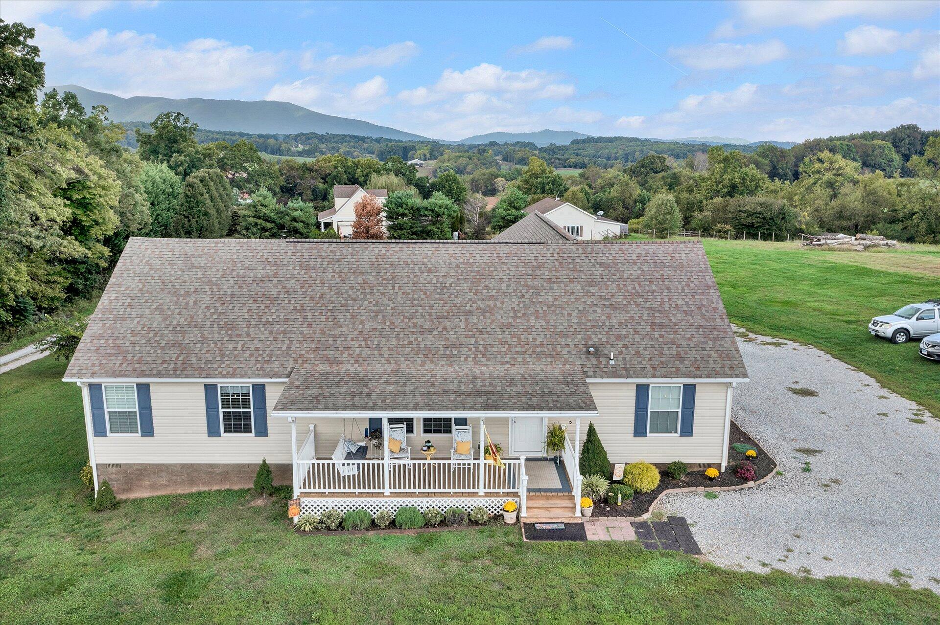 an aerial view of a house with table and chairs