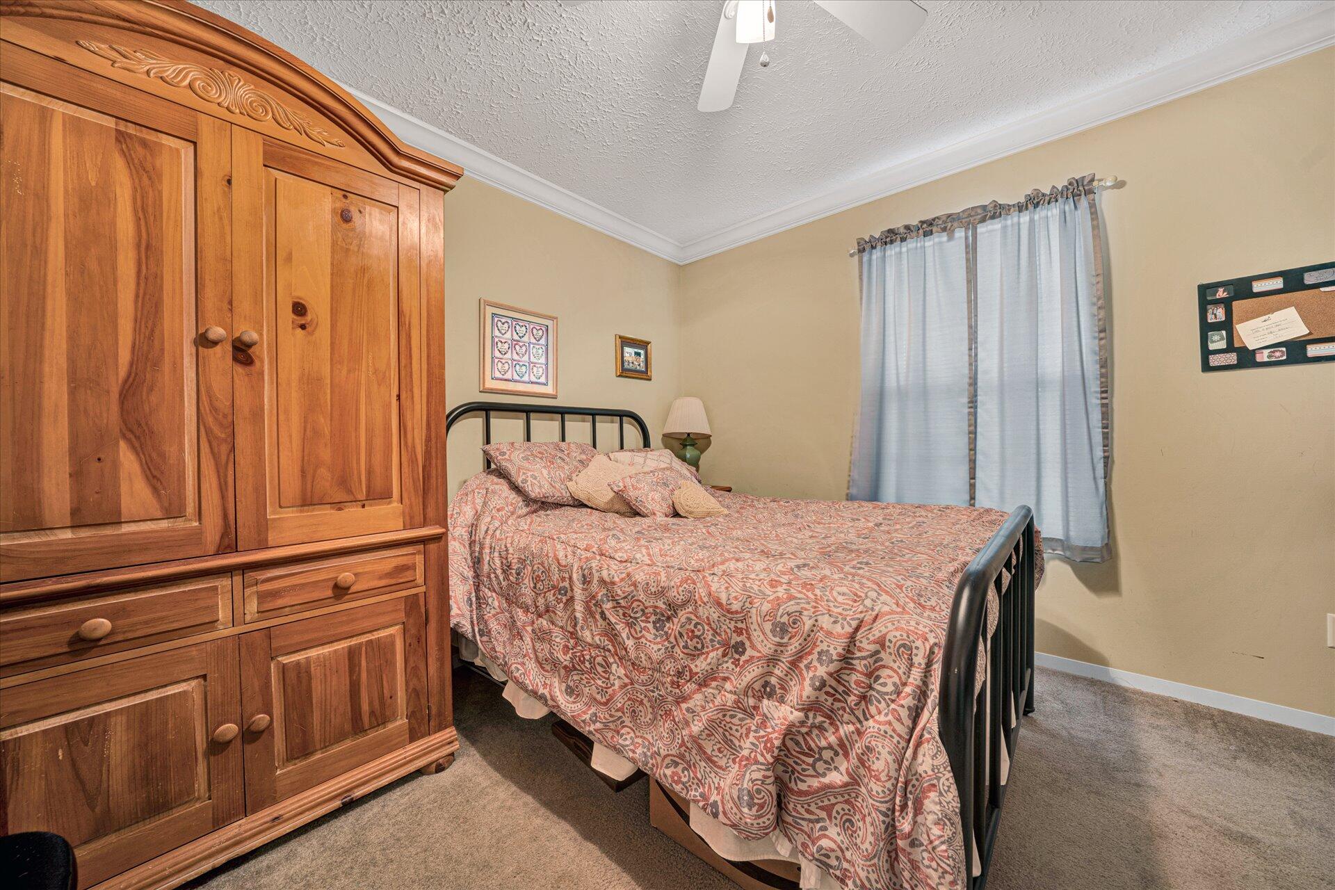2220 Callaway Road Rocky Mount, VA 24151 - Photo 18 of 22 a bedroom with a bed and a window