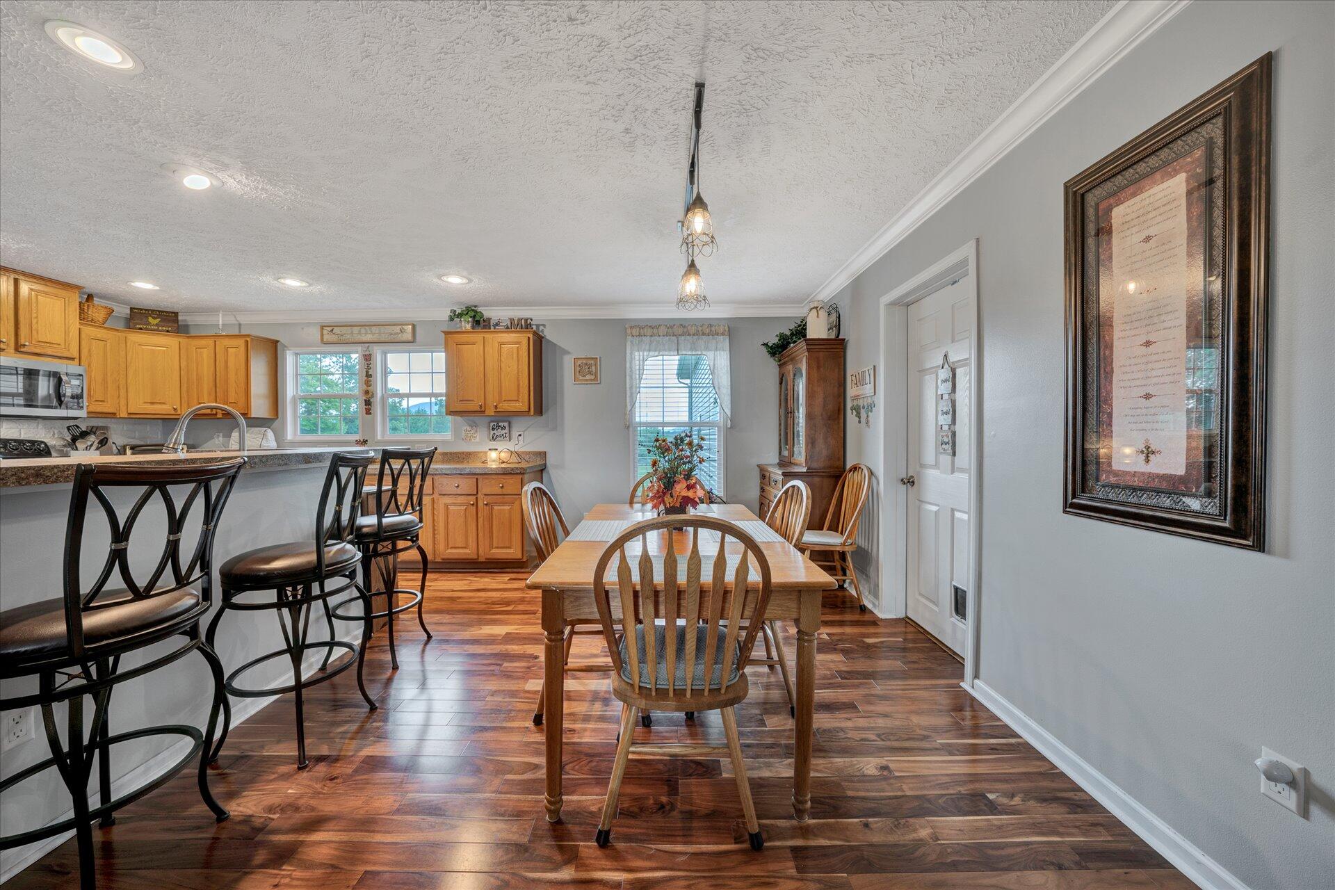 2220 Callaway Road Rocky Mount, VA 24151 - Photo 6 of 22 a view of a dining room with furniture window and wooden floor